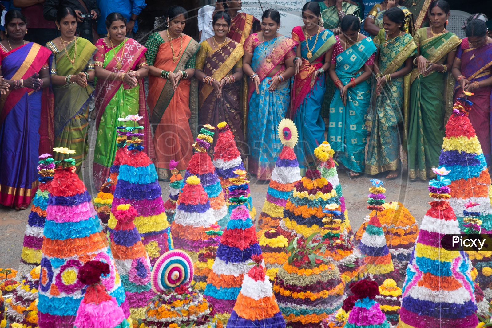Women of Telangana celebrate Bathukamma, a floral decoration made from medicinal flowers and fragrances arranged like a temple gopuram.