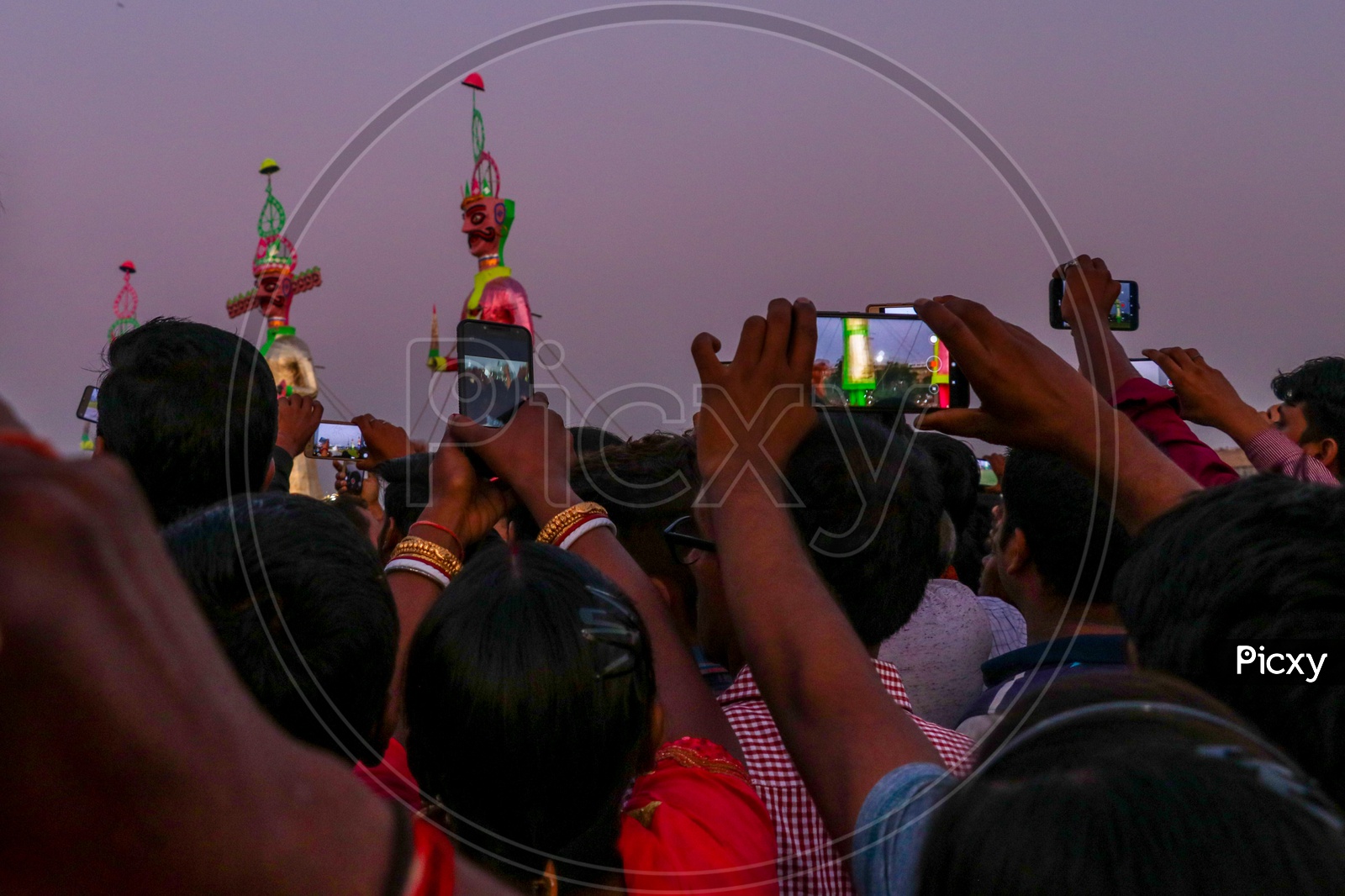 Crowd taking photos and videos of effigies of Ravan during Dussehra celebrations, 2019.