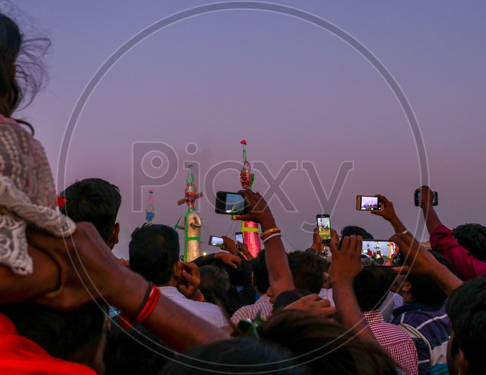 Crowd taking photos of the effigies of Ravan during Dussehra celebrations, 2019.