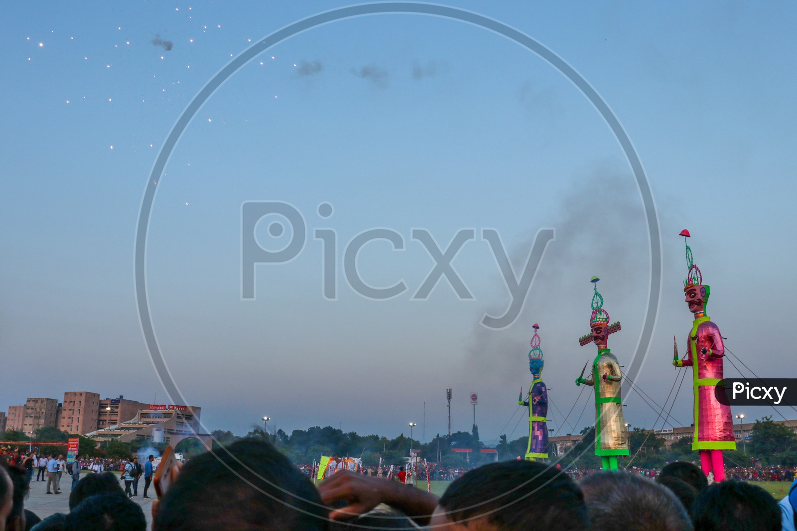 Crowd watching the fire crackers near effigies of Ravan during Dussehra celebrations, 2019.