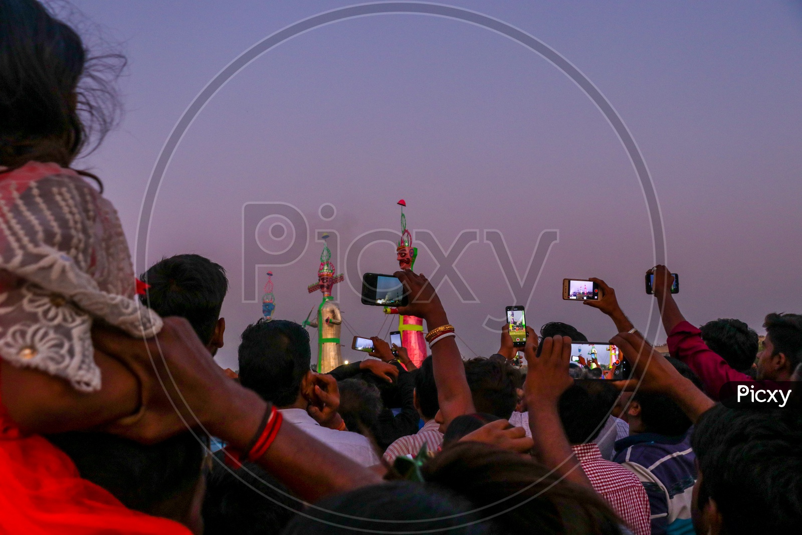 Crowd taking photos of the effigies of Ravan during Dussehra celebrations, 2019.