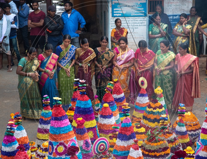 Women of Telangana celebrate Bathukamma, a floral decoration made from medicinal flowers and fragrances arranged like a temple gopuram.