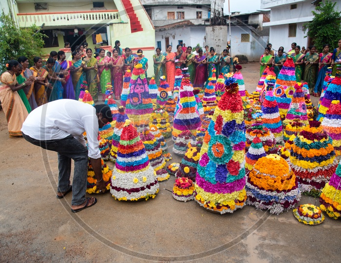 Bathukamma, a floral decoration made from medicinal flowers and fragrances arranged like a temple gopuram.