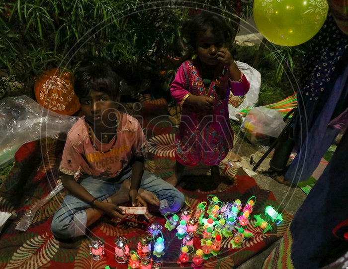 Children selling plastic toys