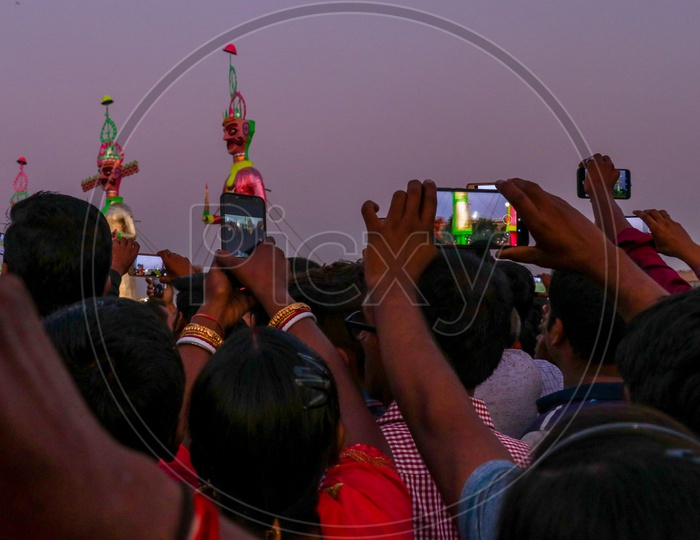 Crowd taking photos and videos of effigies of Ravan during Dussehra celebrations, 2019.