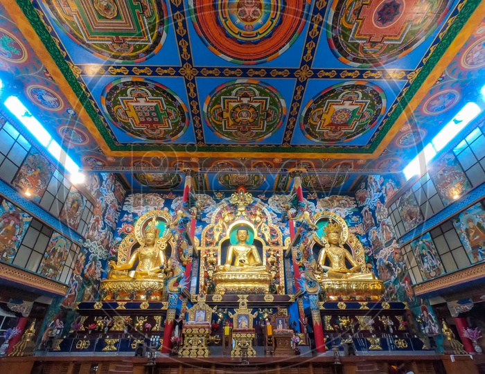 Golden Buddhist Idols At Buddha Temple In Namdroling Monasttery
