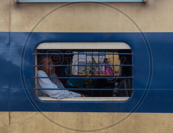 Man sleeping near train window