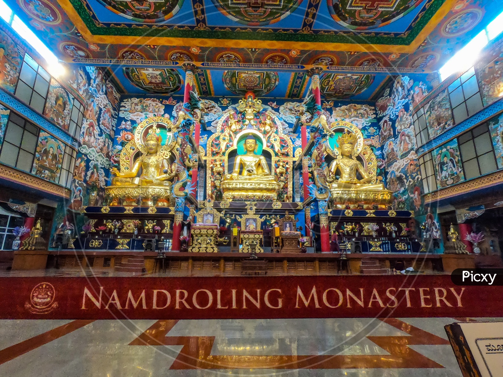 Golden Buddhist Idols At Buddha Temple In Namdroling Monasttery