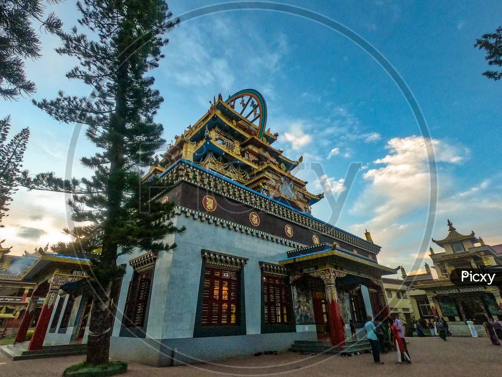 A View Of Buddhist Golden Temple With Blue Sky At Namdroling Monastery In Bylakuppe, Karnataka