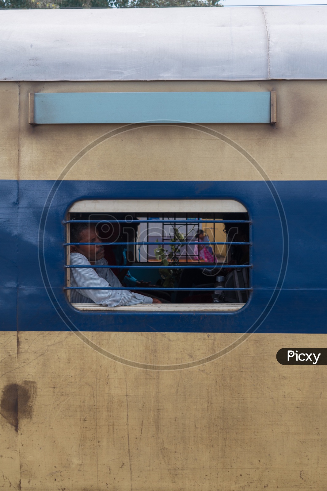 Man sleeping near train window