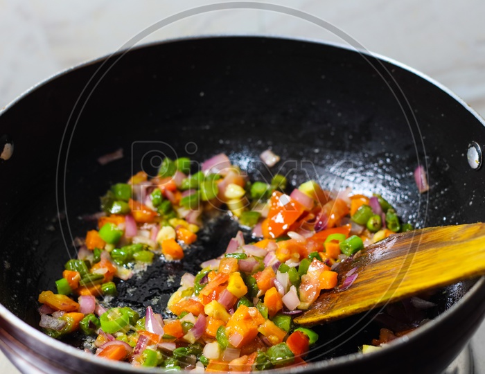 Finely Chopped Vegetables Fried In Oil In A Frying Pan Closeup View