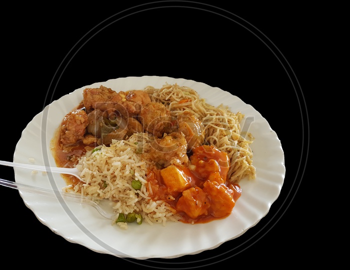 Chinese Food Noodle And Chilli Chicken Gravy On A Plate With Black Background With Space For Text