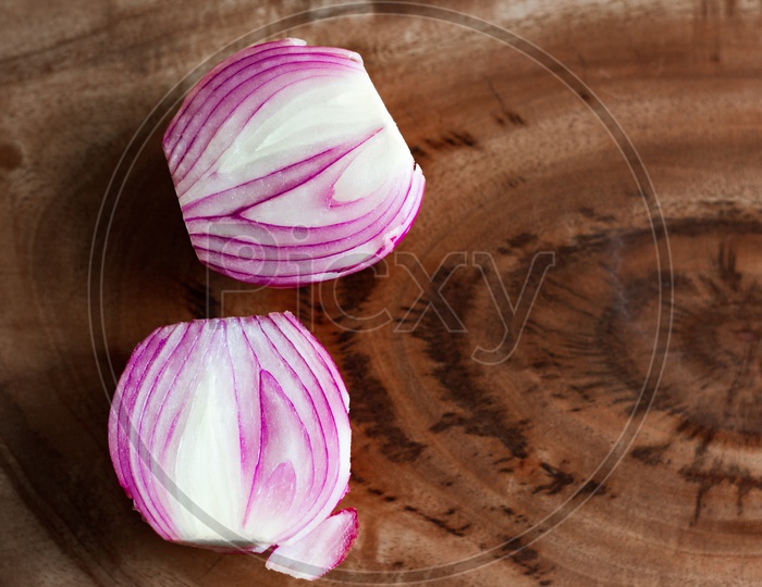 Onion Cut Macro Close Up In Wooden Background With Copy Space