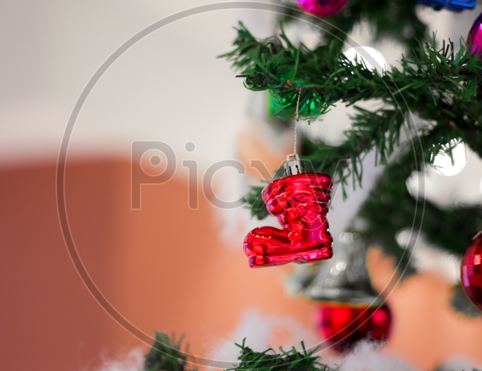Christmas Decoration With Drums Toffee Gift Bells Balls Boxes Boots Stars With Christmas Tree And Cotton With Blurred Background