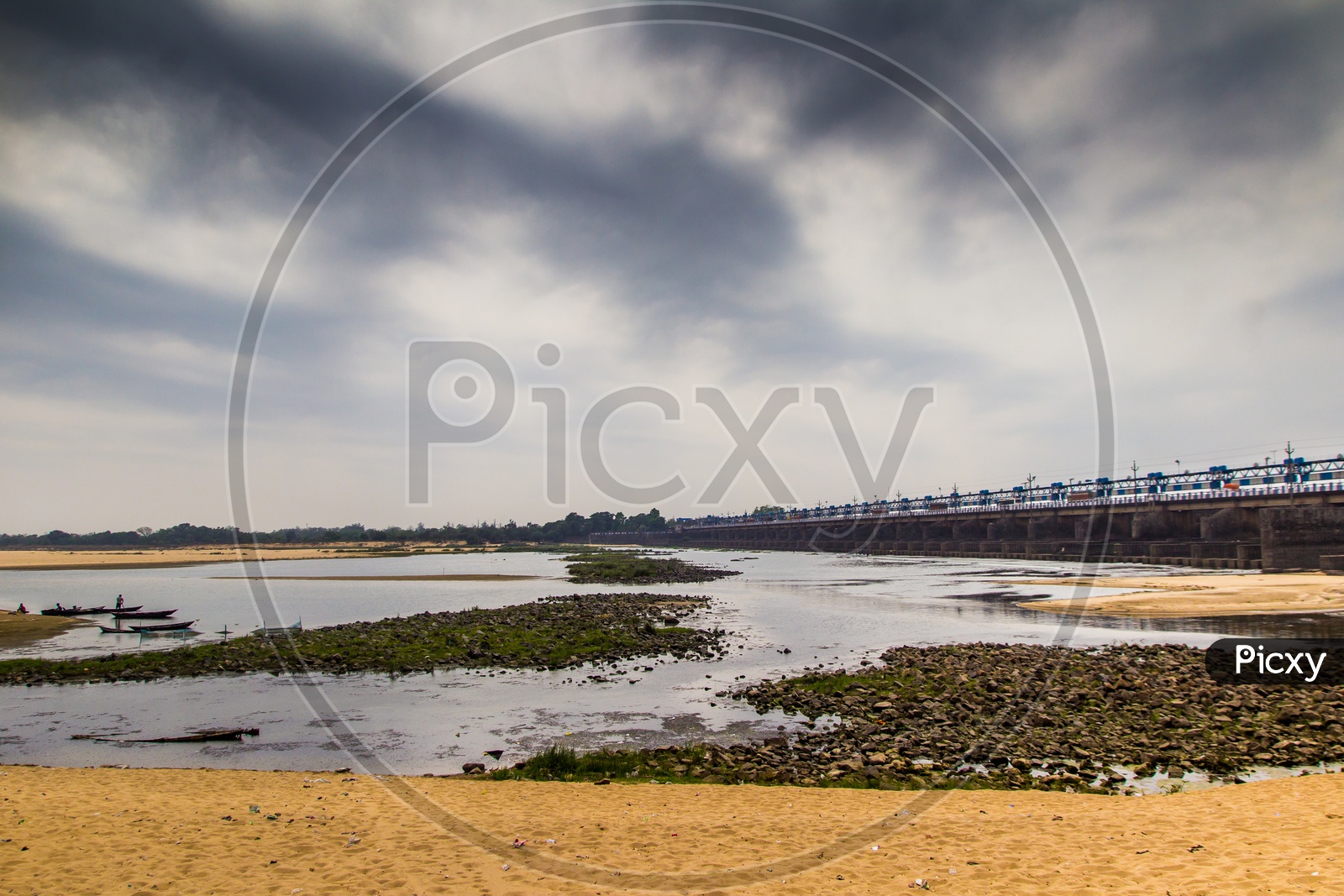 Landscape Scene Of River Bed Sandy Beach With Cloudy Sky