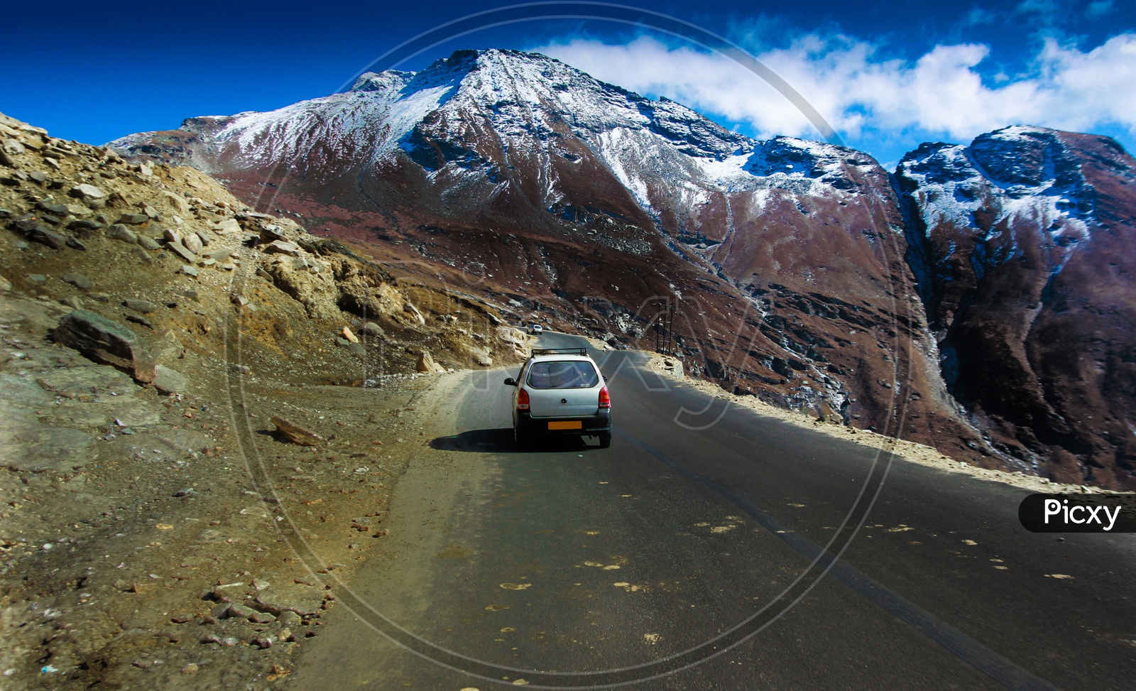 Car Driving In Hilly Highway With Green Pasture And Blue Sky On The Way To Himalaya From The Road,Manali Tourism Himachal Leh Ladakh, India