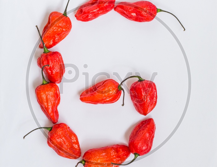 Letter G Alphabet Made With Ghost Pepper Bhoot Jolokia Over White Background