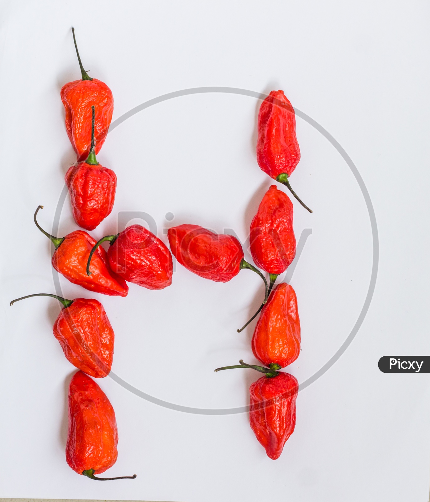 Letter H Alphabet Made With Ghost Pepper Bhoot Jolokia Over White Background