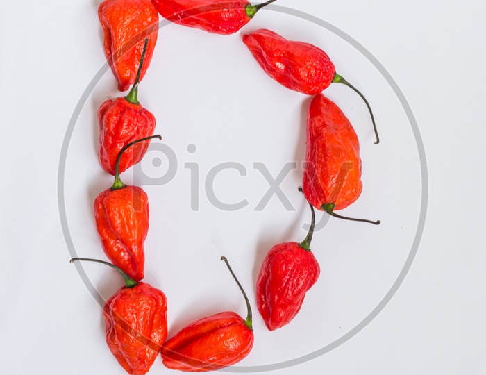 Letter D Alphabet Made With Ghost Pepper Bhoot Jolokia Over White Background
