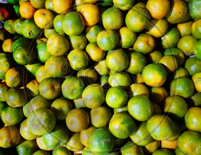 Heap Of Ripe Green Yellow Sweet Lemon Mosambi Lebu For Sale In Fruit Market