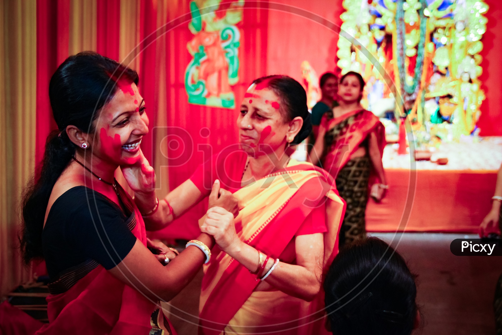 September, 2017,Kolkata,India. Two Unidentified Ladies Playing Vermilion Sindur Khela On The Day Of Dashami.
