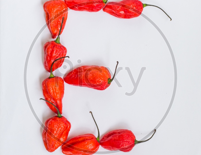 Letter E Alphabet Made With Ghost Pepper Bhoot Jolokia Over White Background