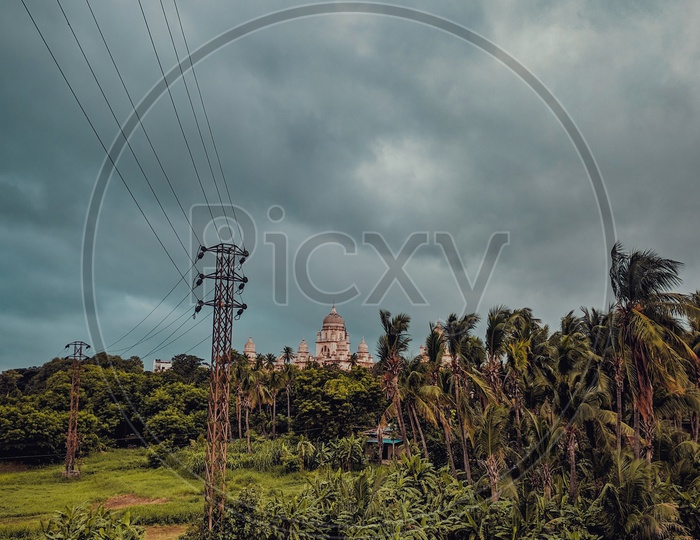 Electric poles With Wires And Dark Clouds in Background