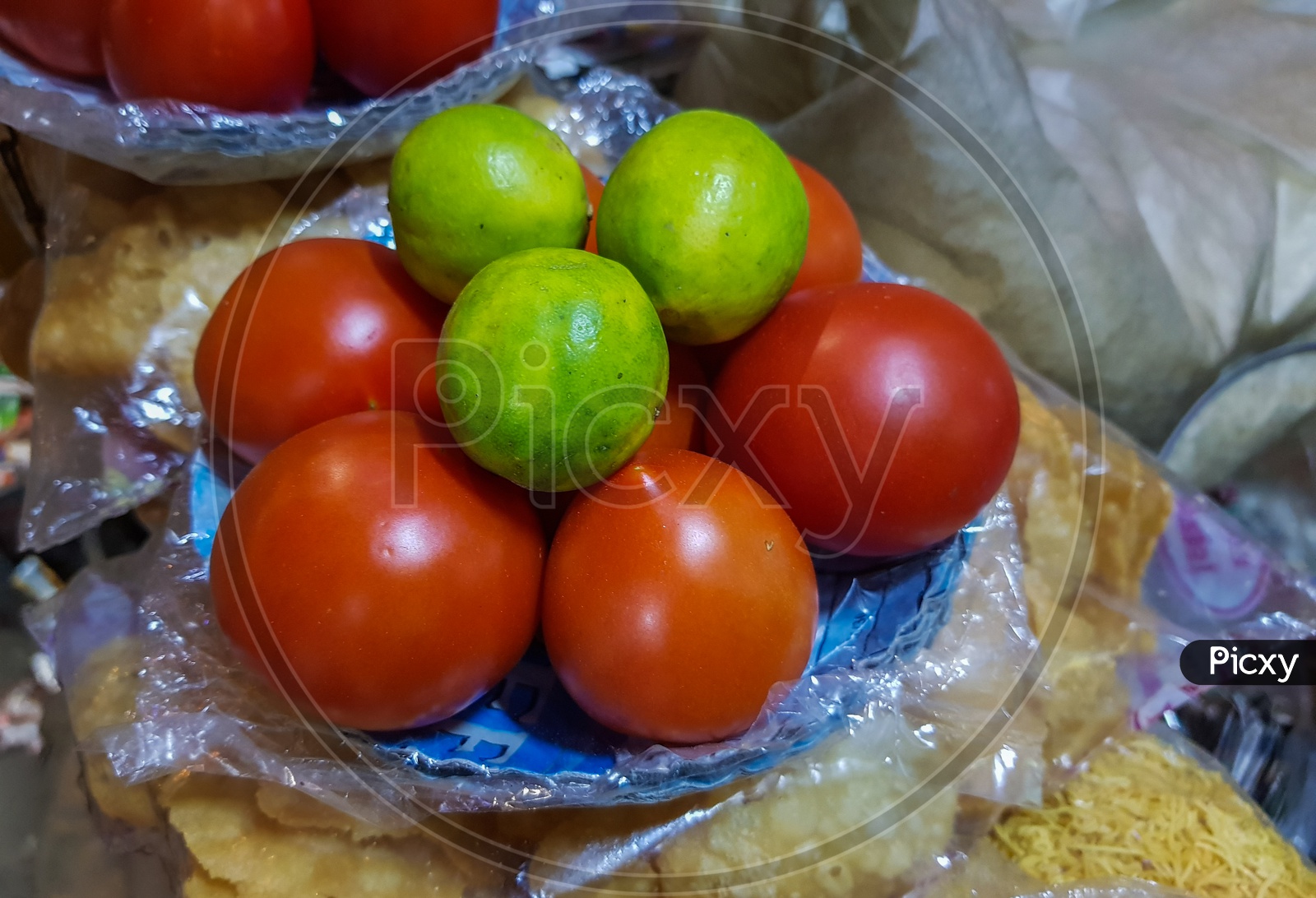 Lemon And Tomato On A Plate In A Chaat Shop
