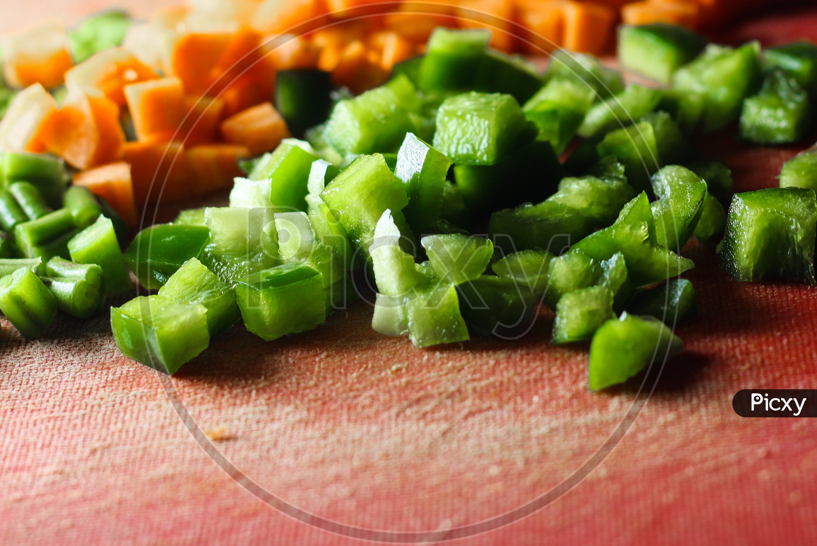 Capsicum And Carrot Cut Into Small Pieces,Finely Chopped Vegetables On A Chopping Board