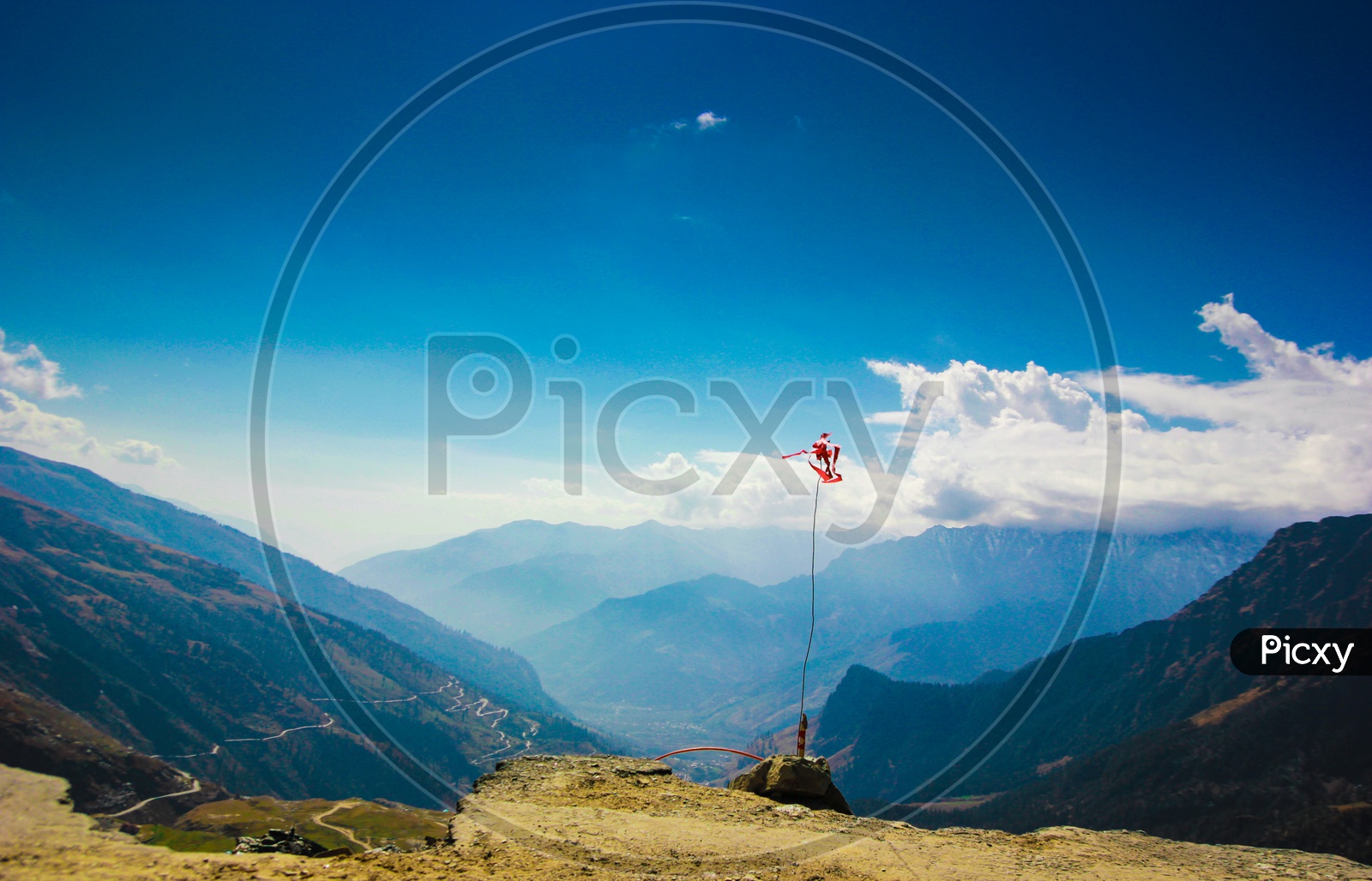 A Red Flag, Holy Symbol In Background Of Himalayas With Blue Skies At Manali, Himlachal India