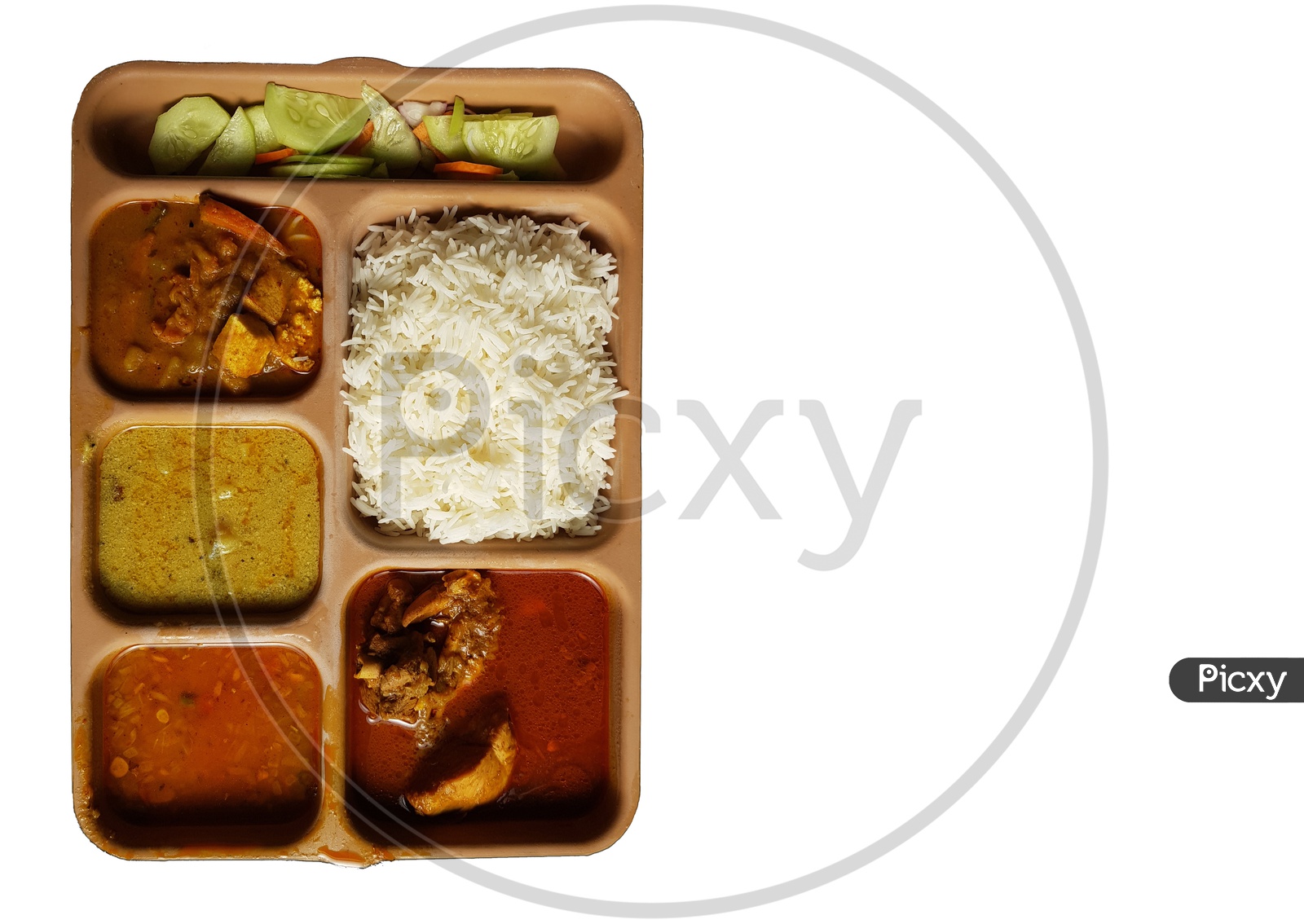 Indian Chicken Thali With Rice Dal Chicken Salad Vegetable Curry On A Plastic Segmented Plate In White Background