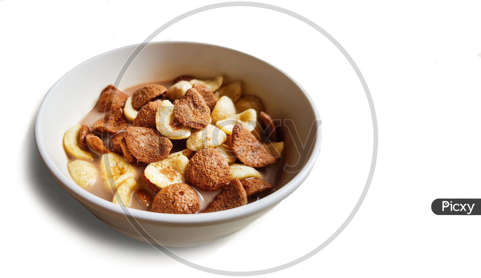 Vanilla And Chocolate Cornflakes Dipped In Chocolate Milk In A White Bowl In Light Background