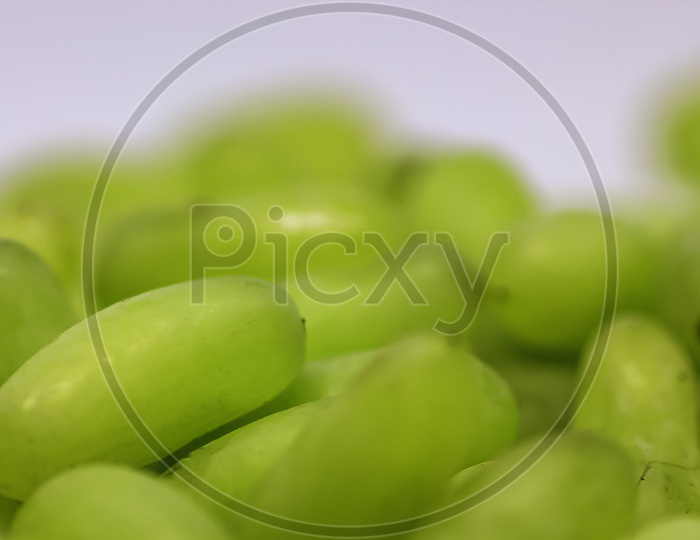 Green Grape Without Branches And Leaves Isolated On White. With Clipping Path. Close Up Macro And Shallow Depth Of Field.