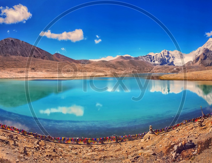 October, 2019, Gurudongmar Lake,North Sikkim, India. Tourist At The Bank Of The Gurudongmar Lake During The Day Time. The Panoramic View Of The Holy Lake Which Is One Of The Highest Fresh Water Lakes Of Asia. Sikkim, India.