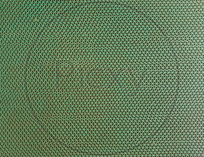 Texture Of Green Mesh With Patterns Forming a Background