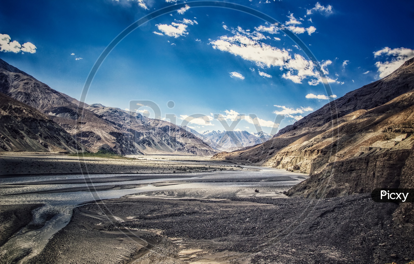 Landscape Photo Ladakh, Kashmir Featuring Blue Skies Mountains Rivers And Road With Shadows