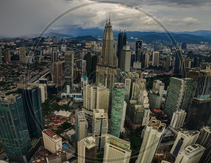 Kuala Lampur, Malaysia - November 2017. Photograph Of The Kuala Lampur City From Top Of Kl Tower Showing Petronas Twin Towers And Modern Highrise Buildings.