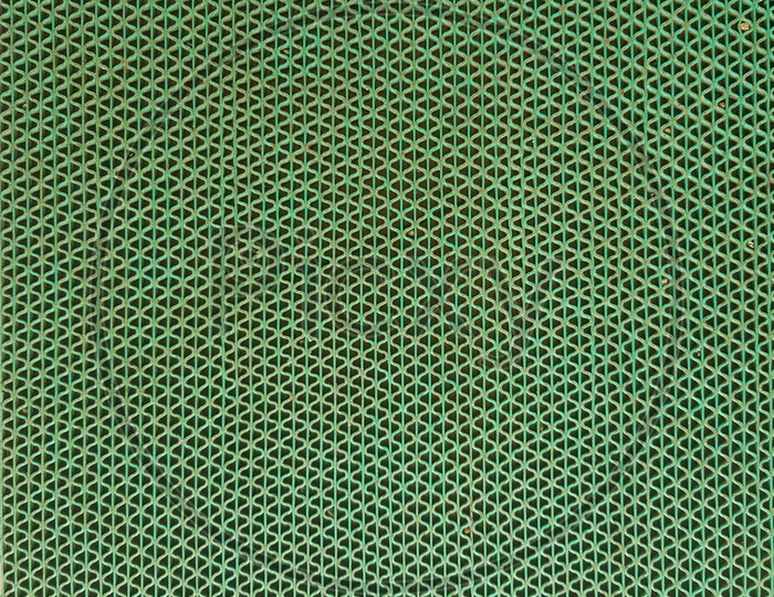 Texture Of Green Mesh With Patterns Forming a Background