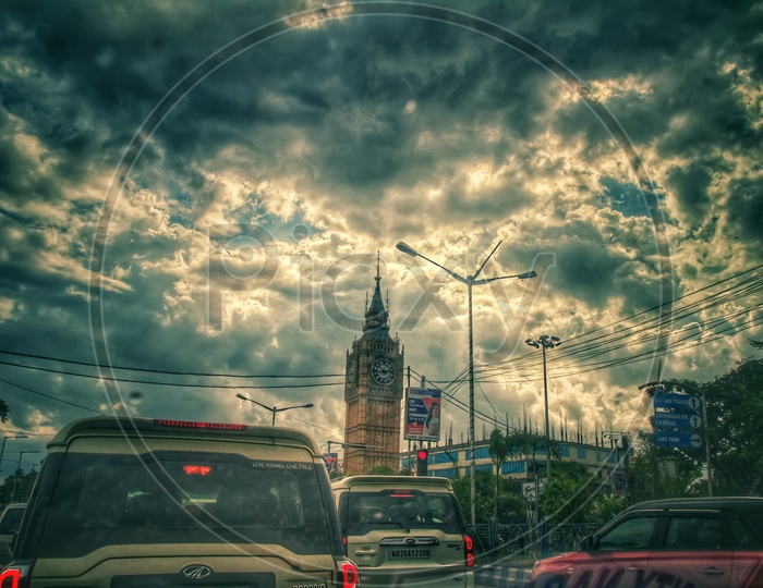 August 21, 2018, Sribhumi, Kolkata, India. A Cloudy Sky View In The Background Of Sribhumi Clock Tower At Kolkata, India During The Day Time With Lot Of Cars On The Streets