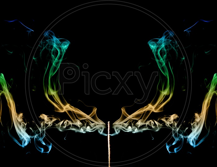 Coloured Smoke Coming Out Of Incense Sticks. Abstract Smoke Art