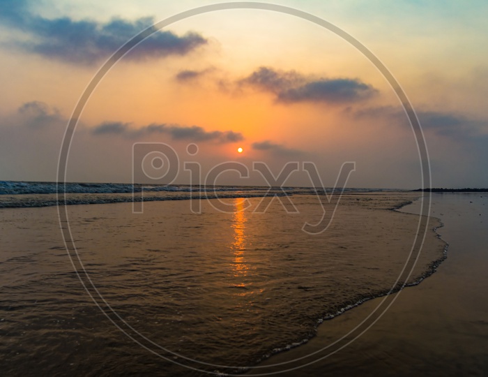 Vivid Sunrise On A Serene Calm Tranquil Deserted Beach At Digha Puri Mandarmaniwith Space For Text