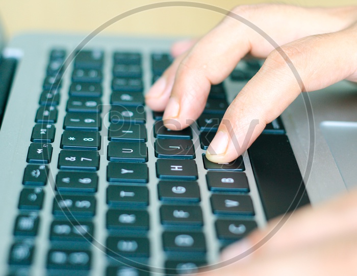 Fingers Typing On Laptop Keys, Closeup Side View