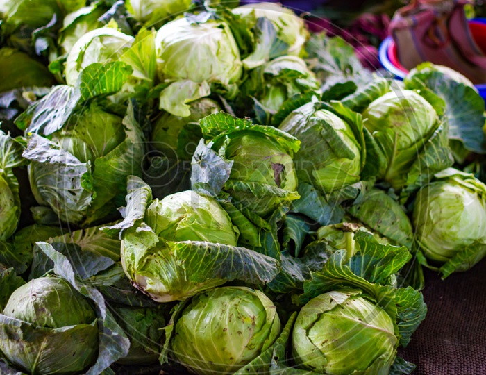Heap Of Green Cabbage In Retail Vegetable Super Market For Sale
