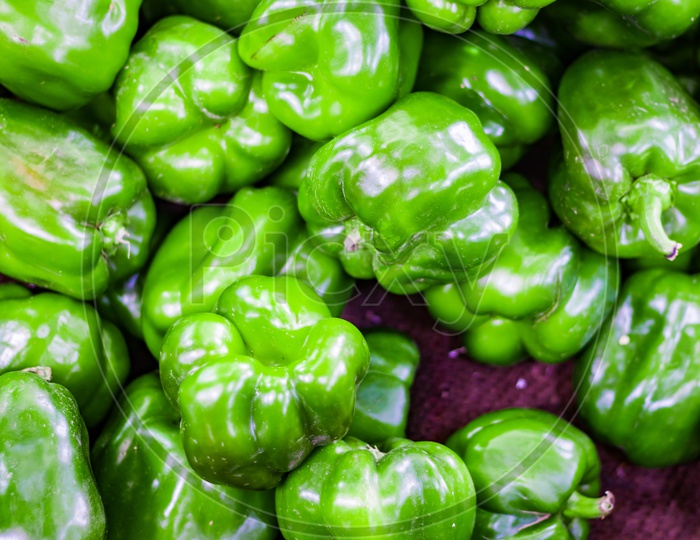 Heap Of Green Capsicum In Retail Vegetable Super Market For Sale