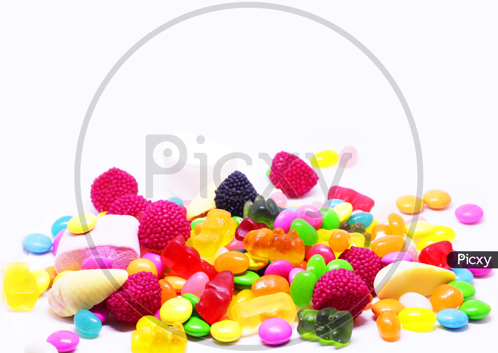 Multiple Colored Sugar Candy In White Background With Space For Text