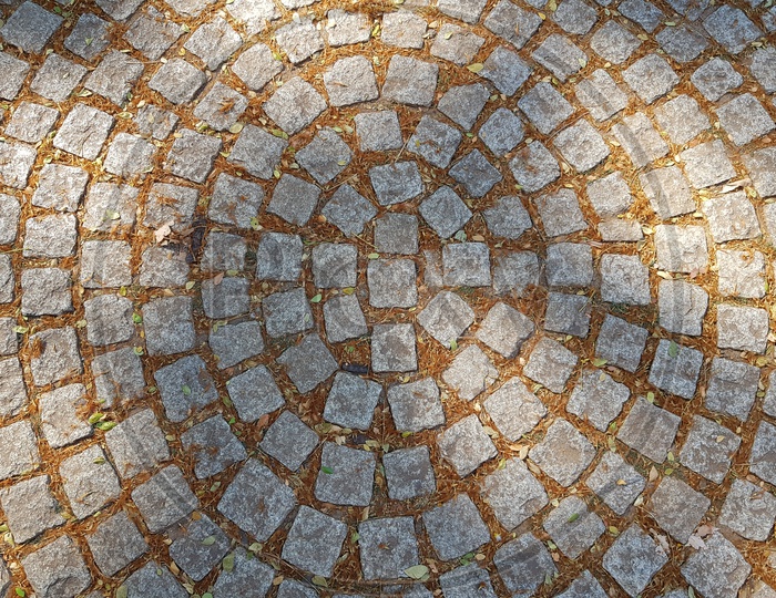 Stone Bricks Closeup With Circular Patterns On  Foot Path  Forming a Background