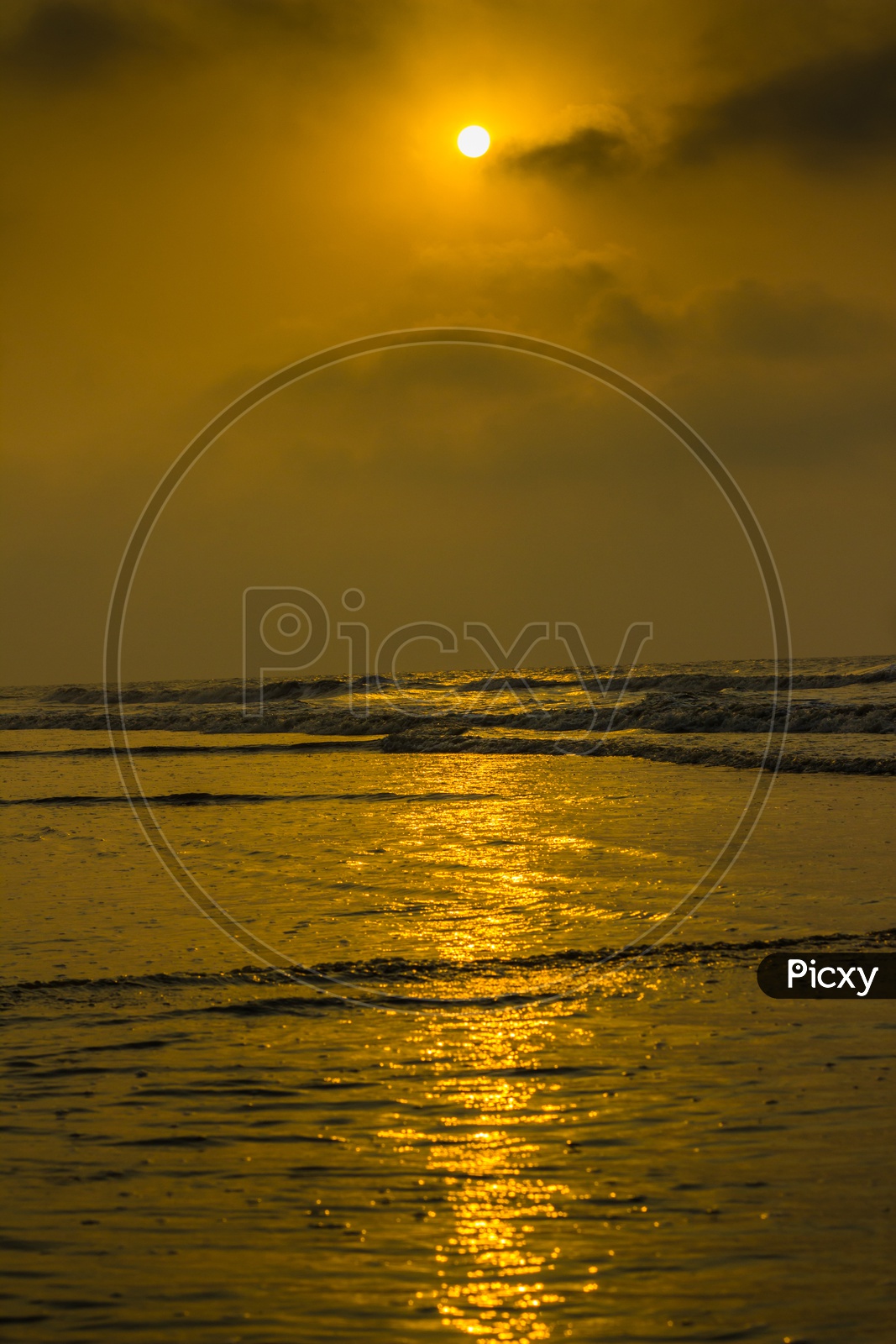 Golden Sunrise Sunset Twilight Hour. Sun Rays Reflecting On Sea Water And Shore.Vertical Orientation