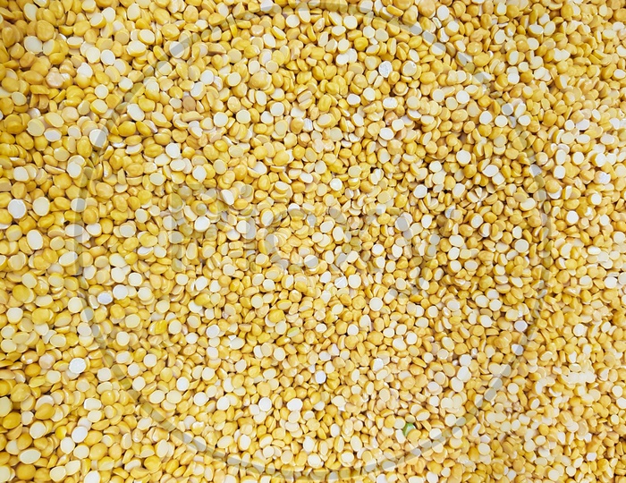 Split Chickpea Lentil Raw Uncooked Beans Moong Dal Close Up. Background Texture
