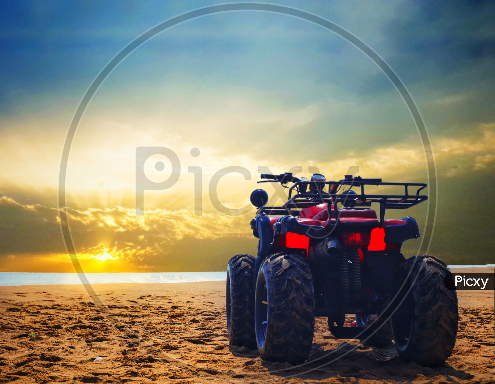 Four Wheeler Dirt Bike On Sand Of Sea Beach During Sunrise With Dramatic Colourful Sky
