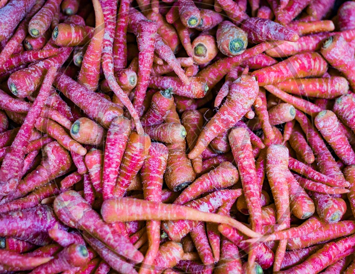 Heap Of Red And Orange Carrots In Retail Vegetable Super Market For Sale